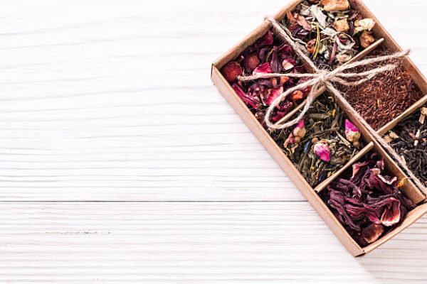 Assortment of dry tea on a wooden table,healthy drink