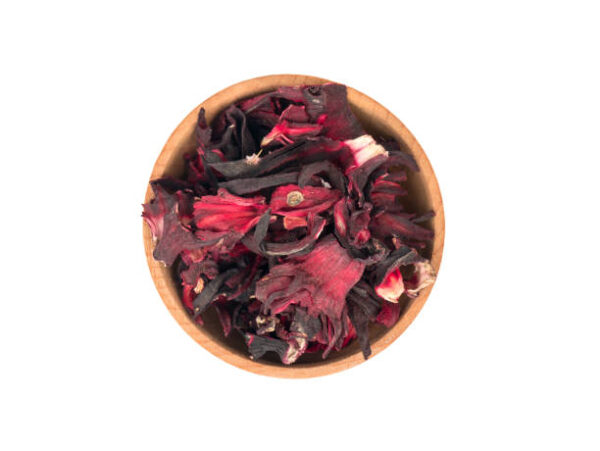 Dry hibiscus tea in a bowl isolated on white background, top view